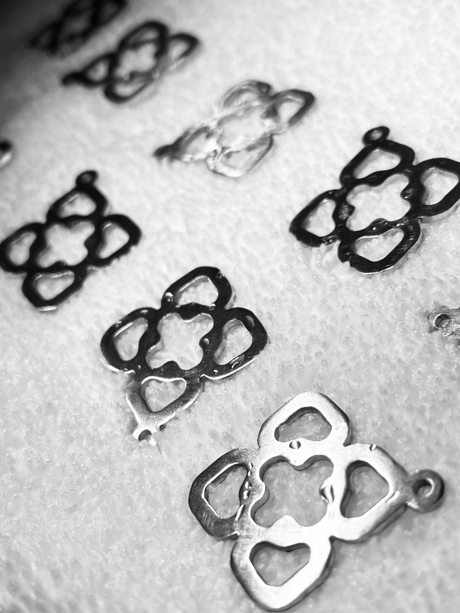 Advance Lab feed — Advance Lab pendants in conceptual flux—post-rinse, suspended between elemental dissolution and intentional emergence, c